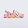 Side view of a pink Free Cute baby sandal with daisy print