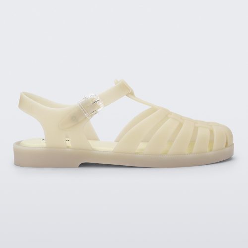 Side view of a light beige Possession sandal