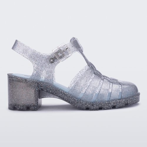 Side view of a clear glitter Possession Heel women's fisherman style sandal.