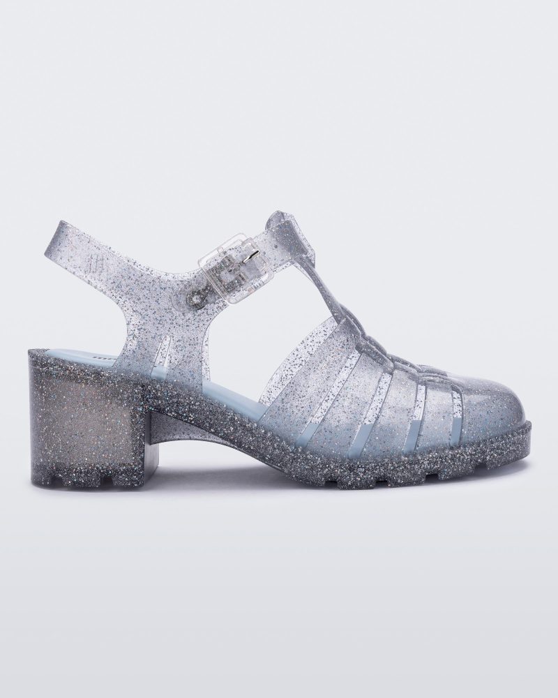 Side view of a clear glitter Possession Heel women's fisherman style sandal.