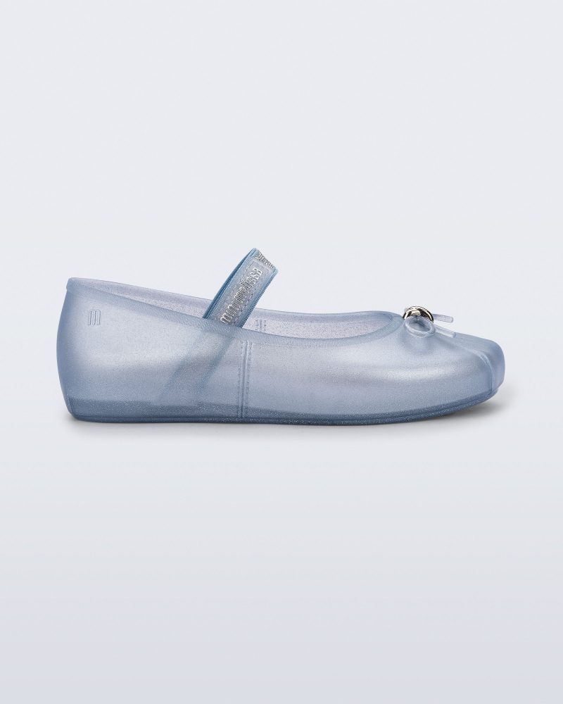 Side view of a pearly blue Sophie kids ballerina flat with bow