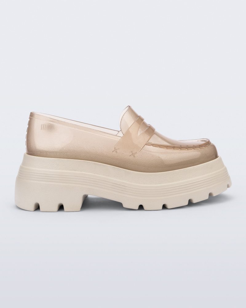 Side view of a transparent beige Royal High + Undercover platform loafer with beige sole.