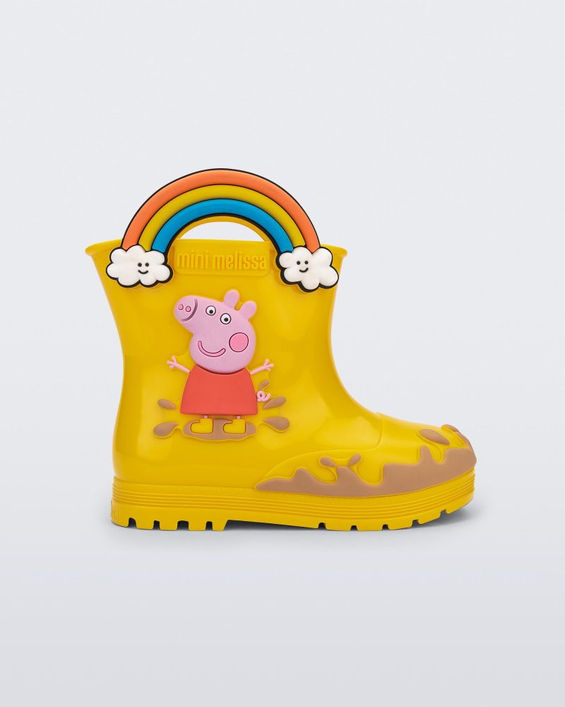 Side view of a yellow Welly Peppa Pig rain boot