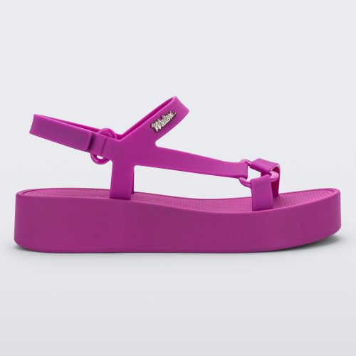 Side view of a dark pink Sun Downtown Platform sandal.