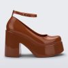 Side view of a brown Melissa Doll Heel platform with ankle strap.