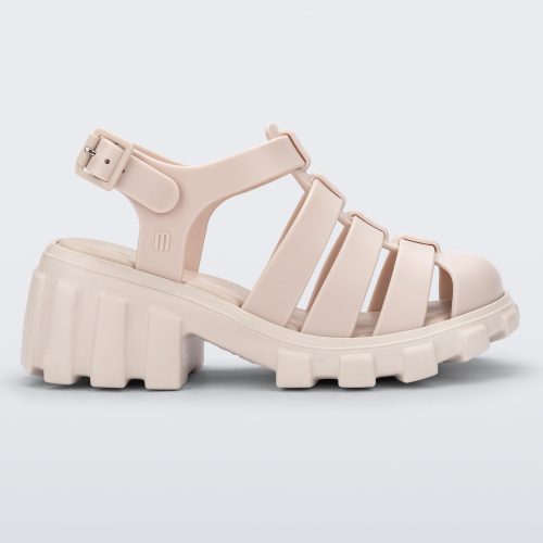 Side view of a beige Megan kids heel sandal.