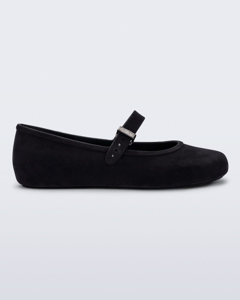 Side view of a black Soft Ballerina Velvet flat.