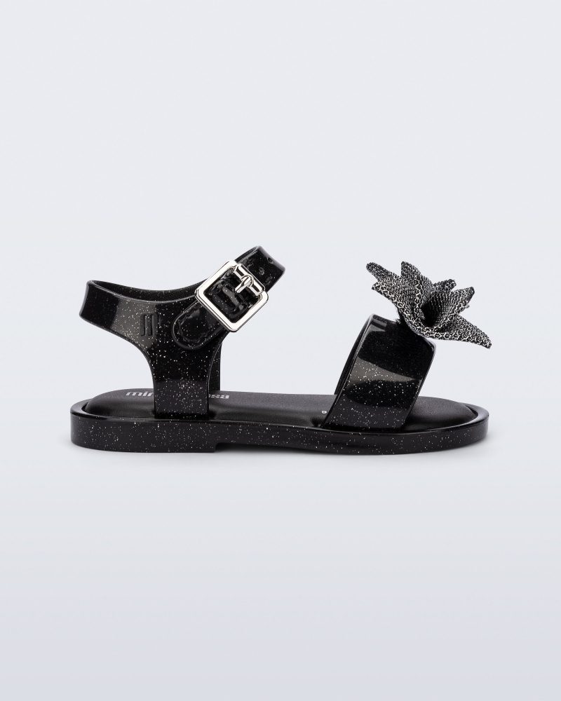 Side view of a glitter black Mar Sweet baby sandal