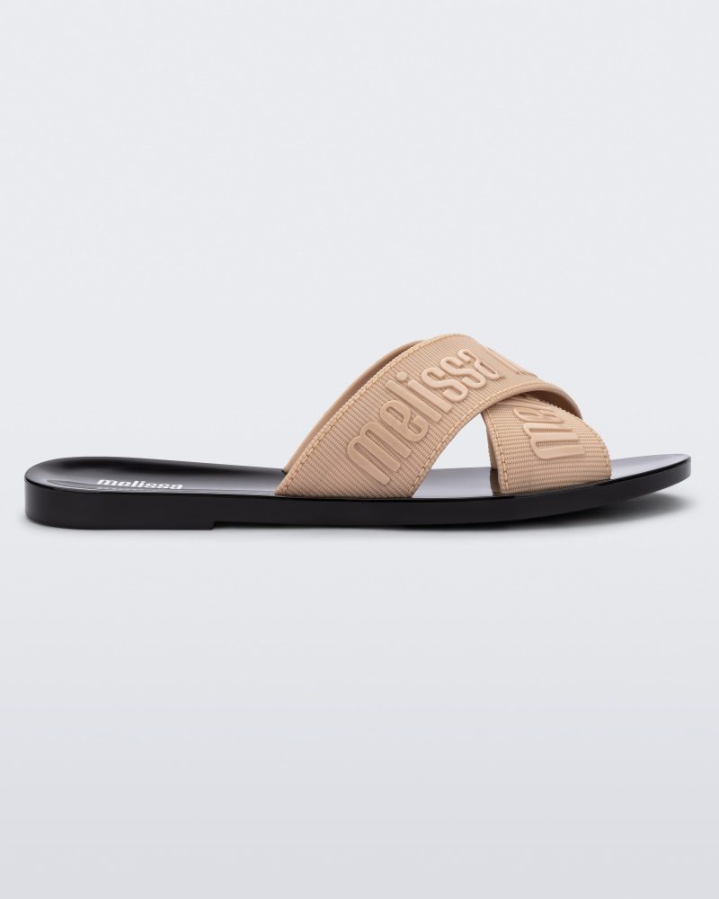 Side view of a beige M Lover adult slide with black sole