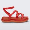 Side view of a red Melissa Buzios platform sandal with multiple textured straps that mimic sisal braids across the front of the shoe as well as an ankle strap