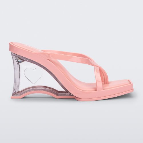 Side view of a pink Glass Heel with a heart cutout in the heel.