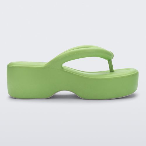 Side view of a Melissa Free platform flip flop in lime green with grey sole