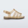 Side view of a clear yellow glitter Mini Melissa Flox sandal with straps.