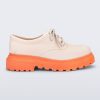 Side view of a beige with orange sole Charlotte adult sneaker loafer with laces