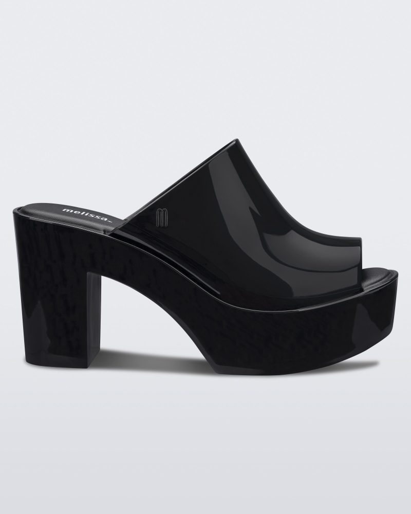 Side view of a black Melissa Mule platform heel.