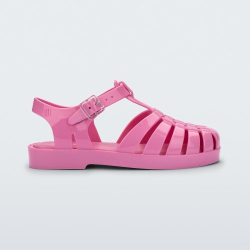 Side view of a pink Mini Melissa Possession sandal with a fisherman sandal design