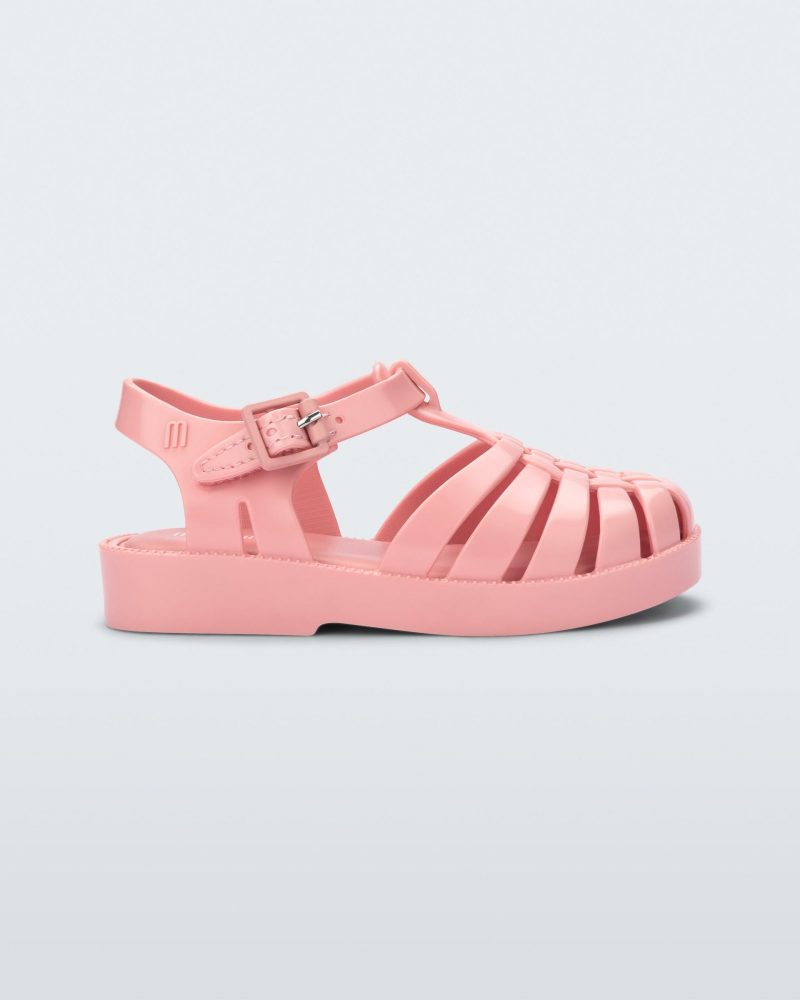 Side view of a light pink baby Possession sandal