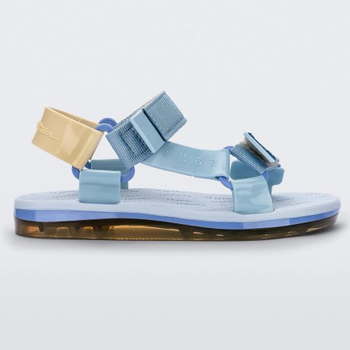 Side view of a blue Melissa Papete sandal with blue and beige straps.