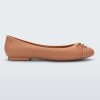 Side view of a dark beige Melissa flat with a beige bow detail with gold accents on the toe