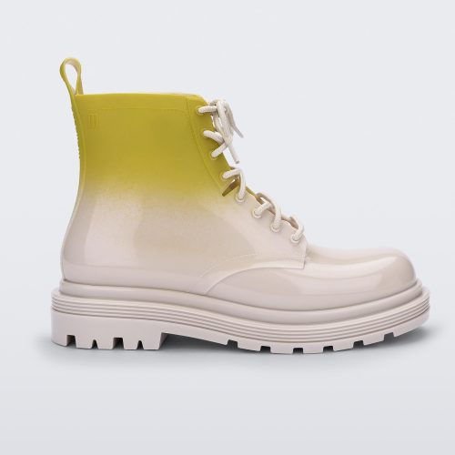 Side view of a beige/green Melissa Coturno boot with a green into beige ombre base, beige laces and sole.