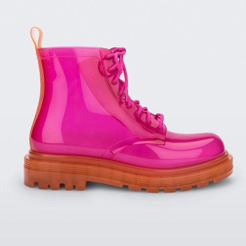 Side view of a pair of a clear orange / pink Melissa Coturno boot with a pink base, laces and an orange sole.