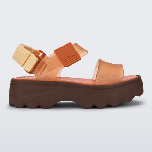 Side view of an orange/clear orange Melissa platform Kick Off sandal with two straps and a brown sole.