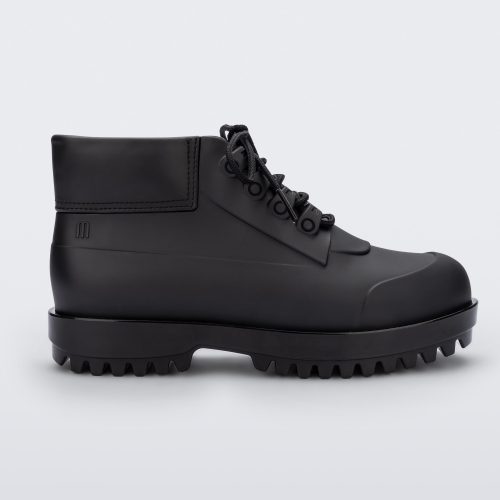 A side view of a matte black Melissa Ares combat boot with a black base, laces and tractor sole.