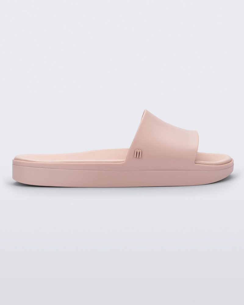 Side view of a light pink Melissa Beach slide.