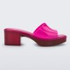 Side view of a Melissa Shape slide with transparent pink platform heel and a hot pink wide front strap.