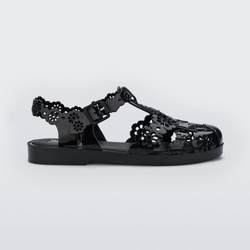 Side view of a Melissa Possession fisherman sandal in black with cut out lace detail on the straps.