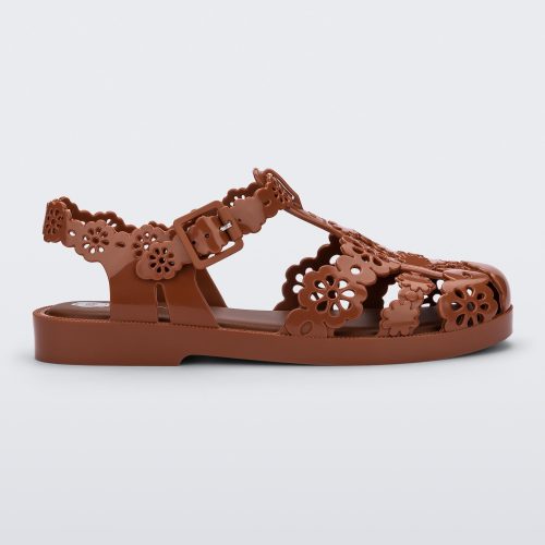 Side view of a Melissa Possession fisherman sandal in brown with cut out lace detail on the straps.