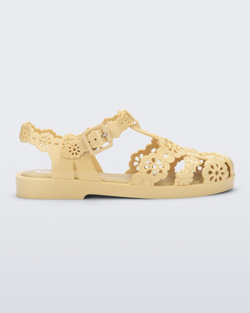 Side view of a Melissa Possession fisherman sandal in yellow with cut out lace detail on the straps.