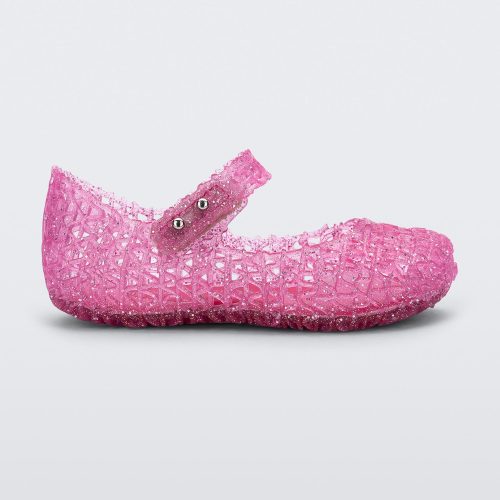 Side view of Mini Melissa Campana pink glitter flats with a snap strap for baby with an open woven texture