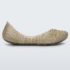 An outter side view of a gold glitter Mini Melissa Campana flat with a woven detail base.