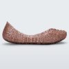 An outter side view of a rose glitter Mini Melissa Campana flats with a woven detail base.