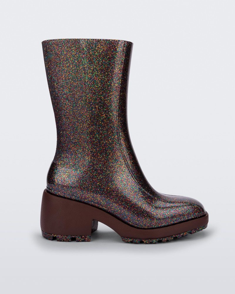 Side view of multicolor glitter Melissa Nancy boots with brown sole.