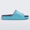 Side view of a blue Mini Melissa Cloud slide with a navy blue insole and a lighter blue base.