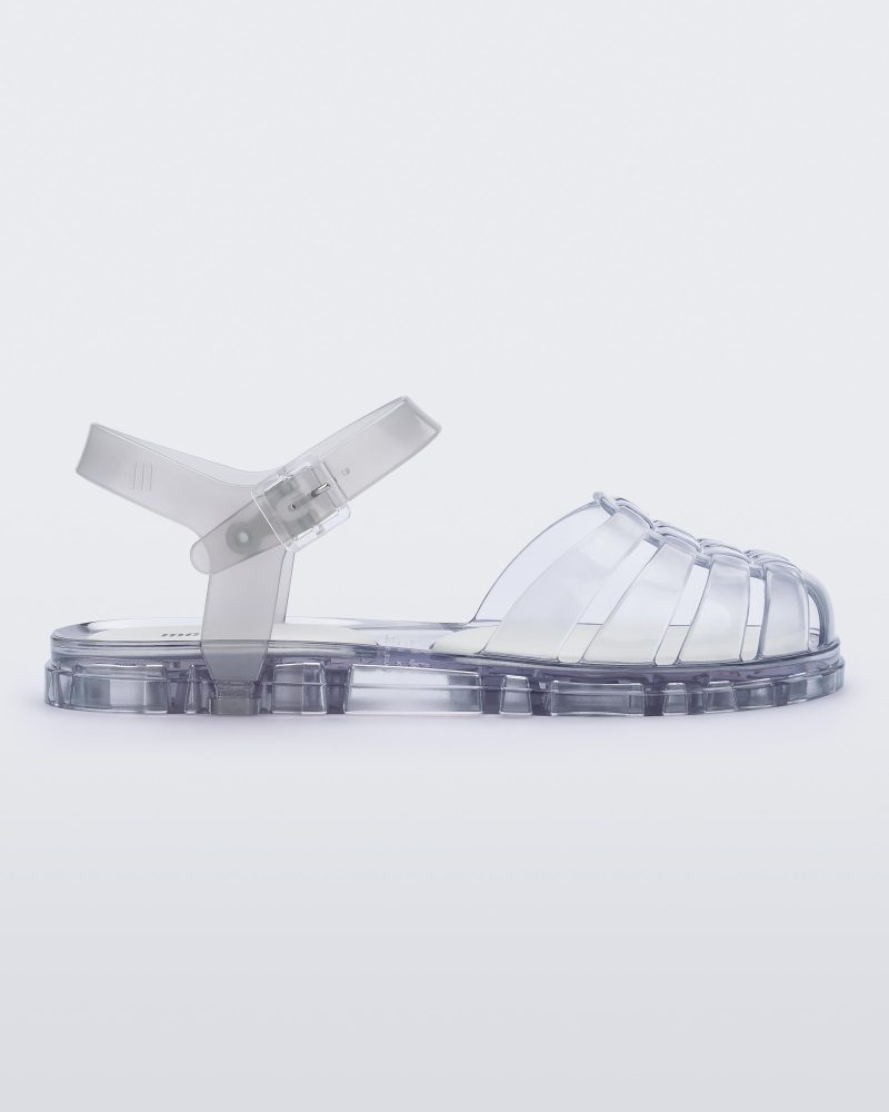 Side view of a clear Melissa Obsessed sandal.