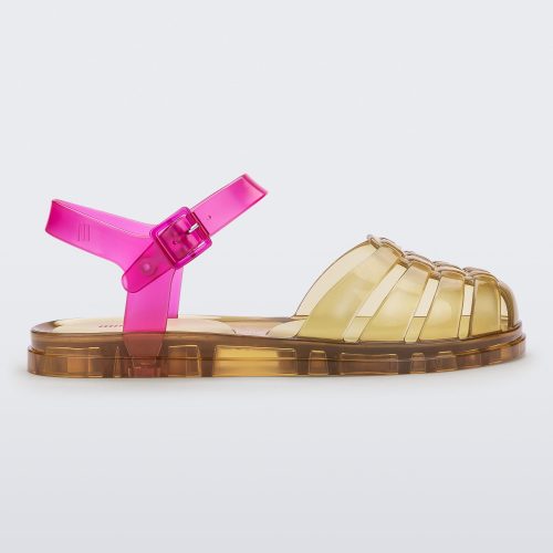 Side view of a transparent yellow and pink Melissa Obsessed sandal.