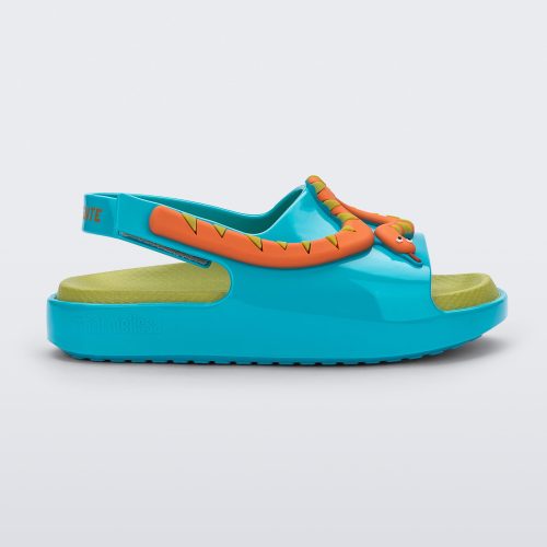 Side view of a blue/green Mini Melissa Cloud sandal with a velcro back strap, a green insole, blue base and orange snake detail on the front.