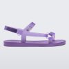 Side view of a Melissa Sun Downtown sandal with transparent lilac front cross and back ankle straps and a lilac purple sole.