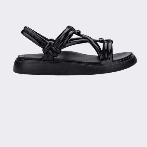 An outter side view of a black Melissa Papete Essential sandal with straps.