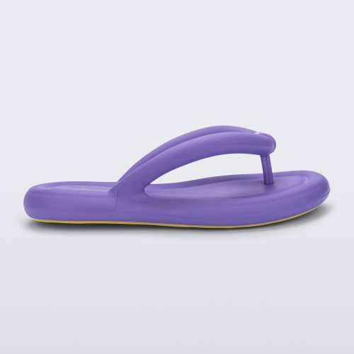 Side view of a lilac Melissa Free Flip Flop with puffer-like straps.