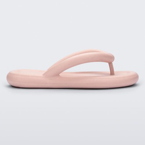 Side view of a light pink Melissa Free Flip Flop with puffer-like straps.