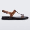 Side view of a clear brown / black Melissa Adore sandal with two translucent brown straps, joined together by a third strap and a black insole.