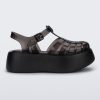 Side view of a black Melissa Possession Platform sandal with several straps and a closed toe front.