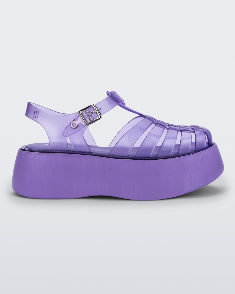 Side view of a lilac Melissa Possession Platform sandal with several straps and a closed toe front.