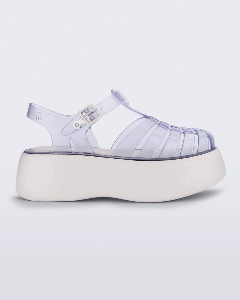 Side view of a Clear/White Melissa Possession Platform sandal with several straps and a closed toe front.