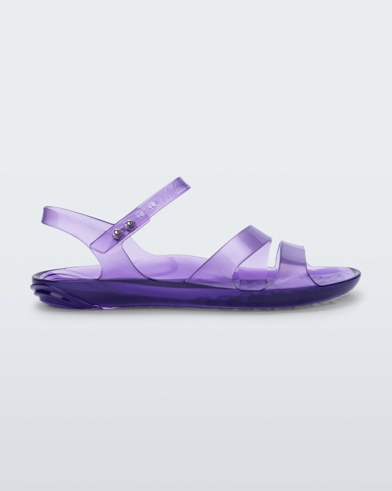 Side view of a lilac Melissa Real Jelly Sandal with two front straps and an ankle strap.