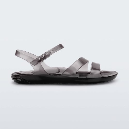 Side view of a black Melissa Real Jelly Sandal with two front straps and an ankle strap.